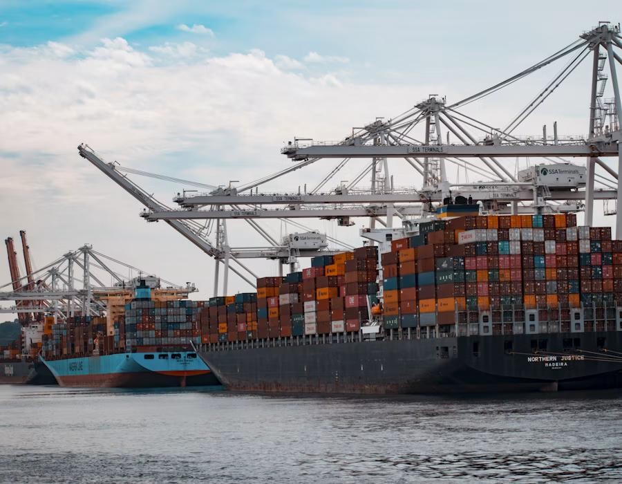 Container ship alongside port cranes